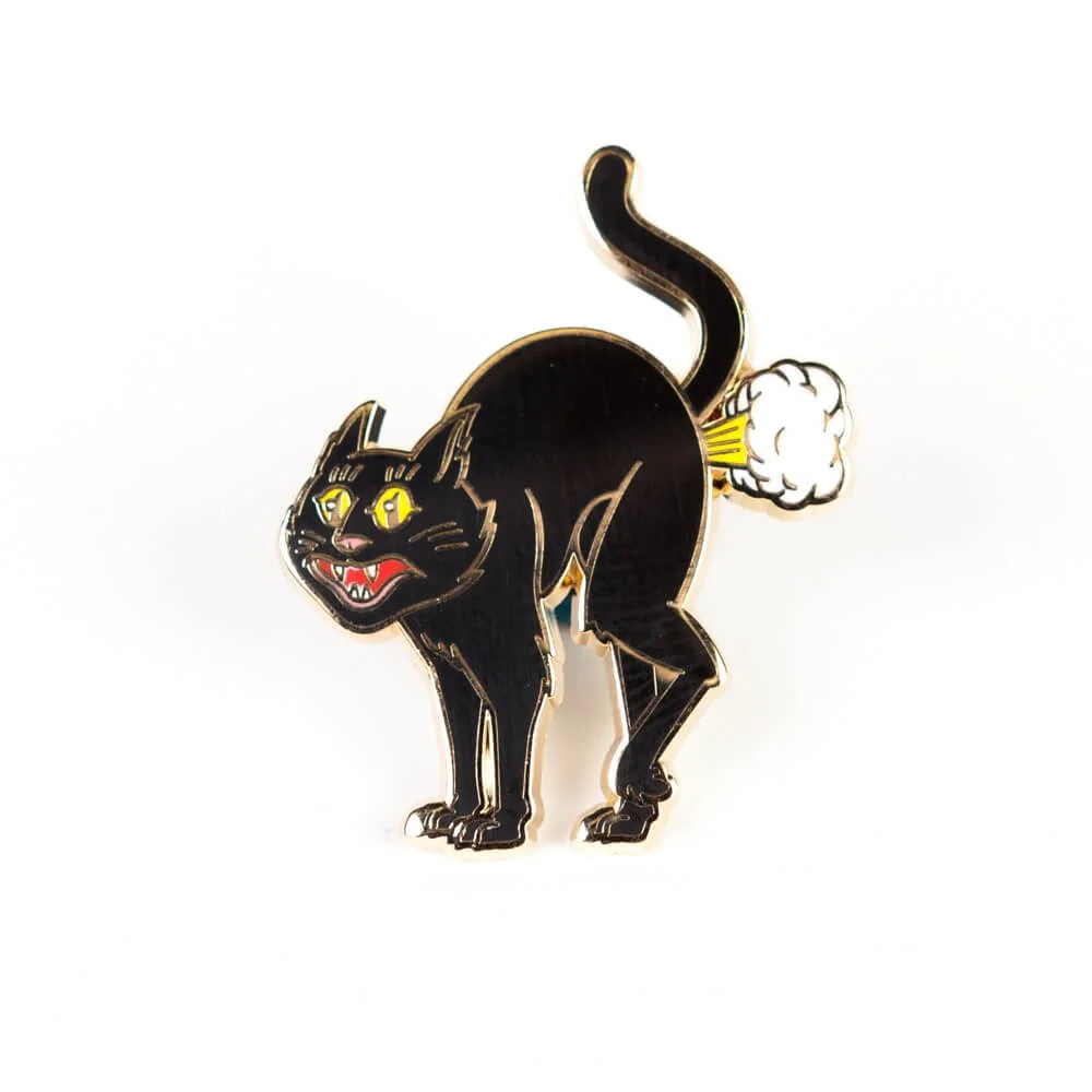 A hard enamel pin of a black cat with an arched back and yellow eyes.
